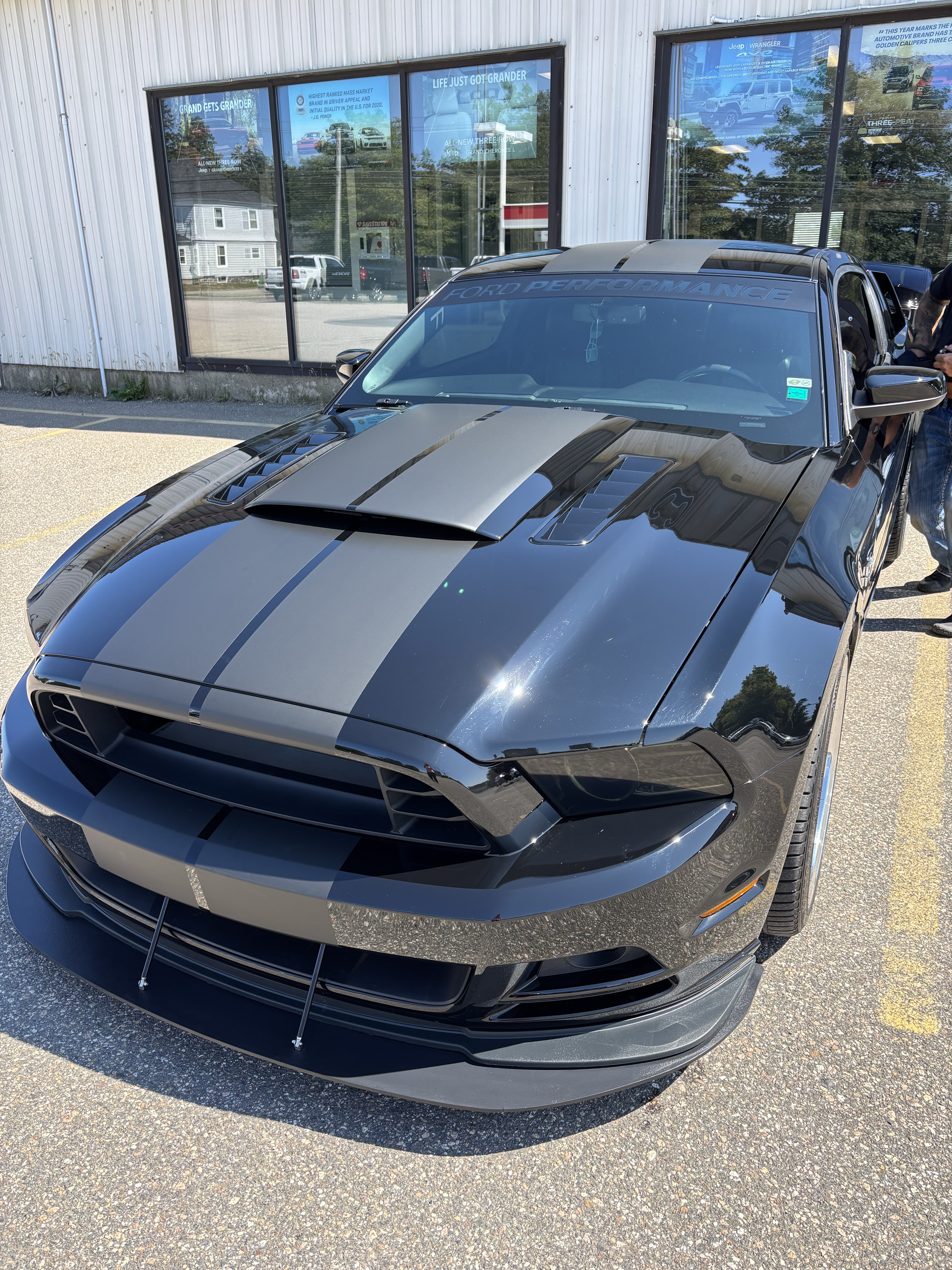 Ford Mustang GT with custom racing stripes — front